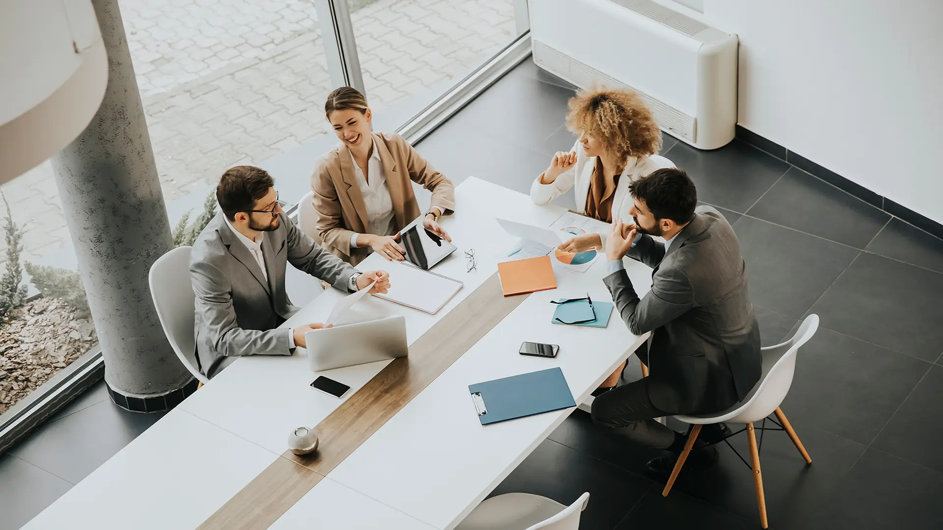A group of people in an office setting, discussing finances with a tax accountant.